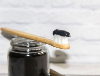 Close-up of small glass in jar on table