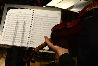 Cropped image of woman holding book