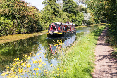 Scenic view of canal by trees