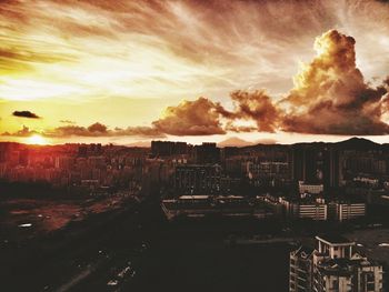 Panoramic view of cityscape against sky during sunset