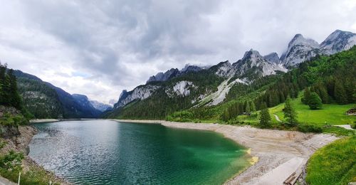 Scenic view of lake and mountains against sky