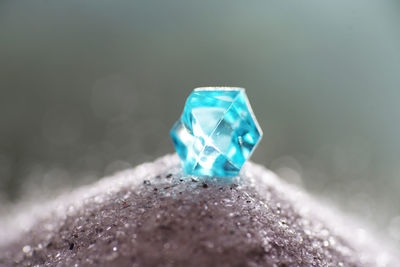 Macro shot of blue crystal on stone