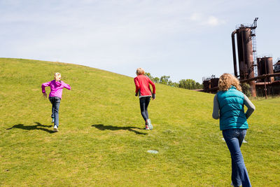 Woman standing on grassy field