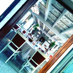 Low angle view of building seen through glass window