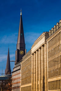 Tower of the st. james church and buildings at hamburg city center on a beautiful early spring day