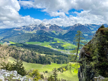 Scenic view of landscape and mountains against sky