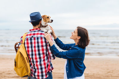 Woman with dog on beach