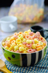 Close-up of multi colored candies in bowl on table