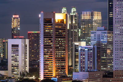 Illuminated buildings in city at night