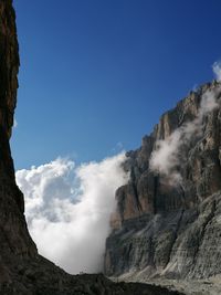 Low angle view of rock formation against sky