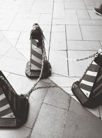 High angle view of shadow on tiled floor