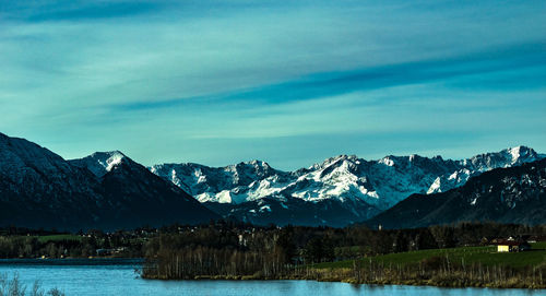 Scenic view of mountains against cloudy sky