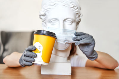 Close-up of hand holding drink