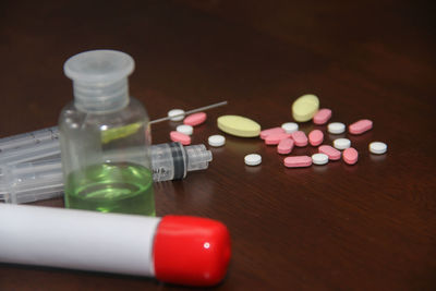 Close-up of multi colored bottles on table