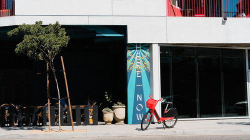 Bicycle on footpath by building