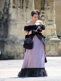 Full length of woman standing outdoors