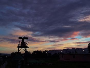 Silhouette tower against sky during sunset