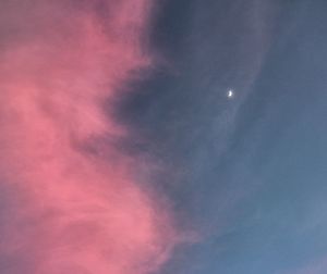 Low angle view of moon in sky at night