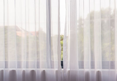 Close-up of glass window in foggy weather