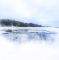 Scenic view of frozen lake against sky