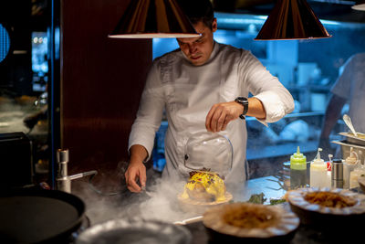 Man preparing food in restaurant