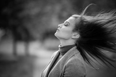 Portrait of woman looking away outdoors