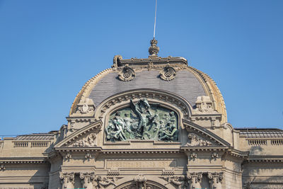 Low angle view of building against clear blue sky