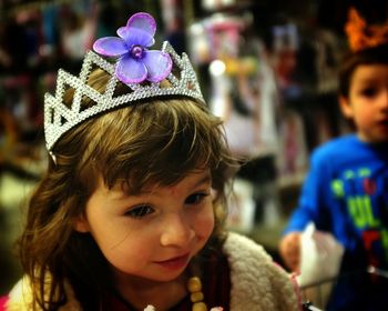 Close-up of cute girl wearing crown during halloween