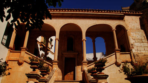 Low angle view of historic building against clear sky