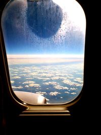 Aerial view of landscape against cloudy sky