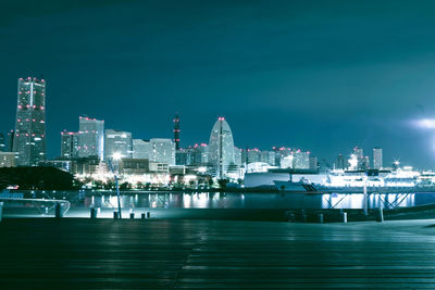 Illuminated city at waterfront