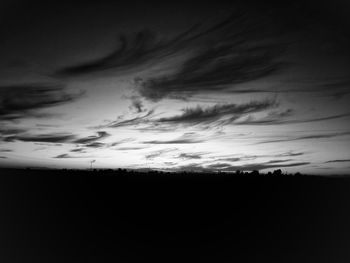 Scenic view of silhouette field against sky