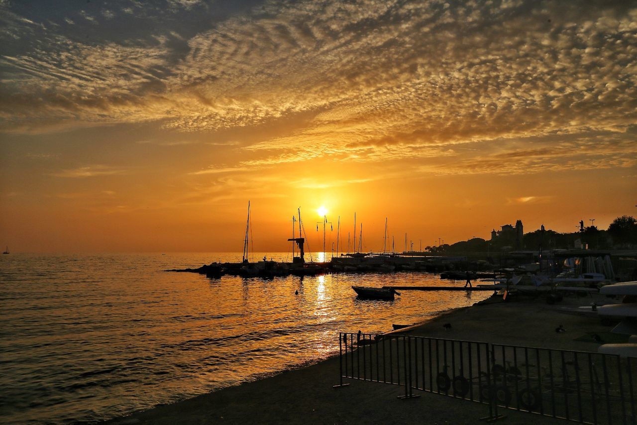 sunset, water, sea, sun, orange color, sky, scenics, tranquil scene, tranquility, beauty in nature, silhouette, nautical vessel, nature, horizon over water, idyllic, transportation, cloud - sky, pier, sunlight, reflection