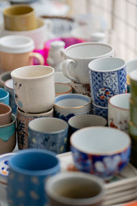 Close-up of cups on table