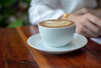 Close-up of coffee cup on table