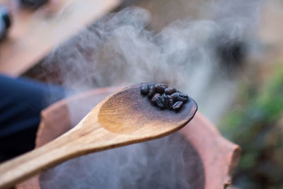 Close-up of wooden spoon with food