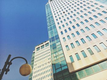 Low angle view of modern buildings against sky