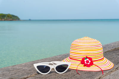 Rear view of woman wearing hat on beach