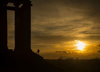 Silhouette of building during sunset