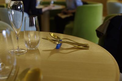 Glasses and eating utensils on restaurant table