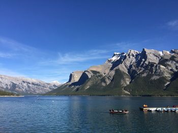 Scenic view of mountains against blue sky