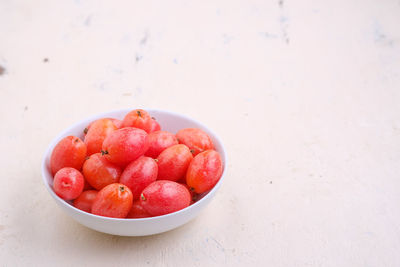 High angle view of strawberries in bowl on table