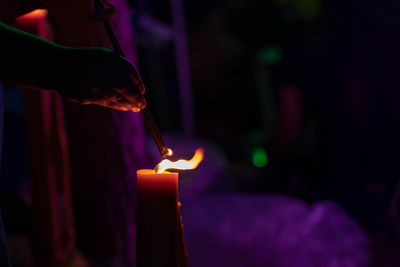 Person holding lit candles