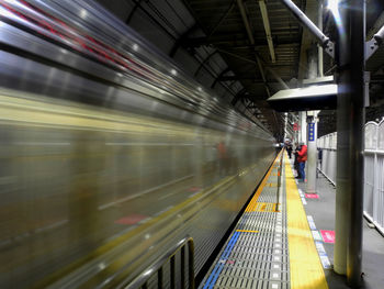 Blurred motion of train at subway station