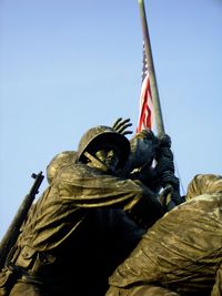 Low angle view of statue against sky