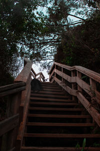 Low angle view of staircase in building against sky