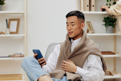 Young man using mobile phone