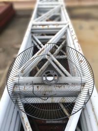High angle view of metal grate on metallic scaffolding at construction site