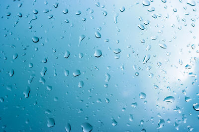 Full frame shot of wet glass window