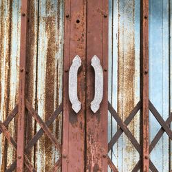 Close-up of rusty metal fence